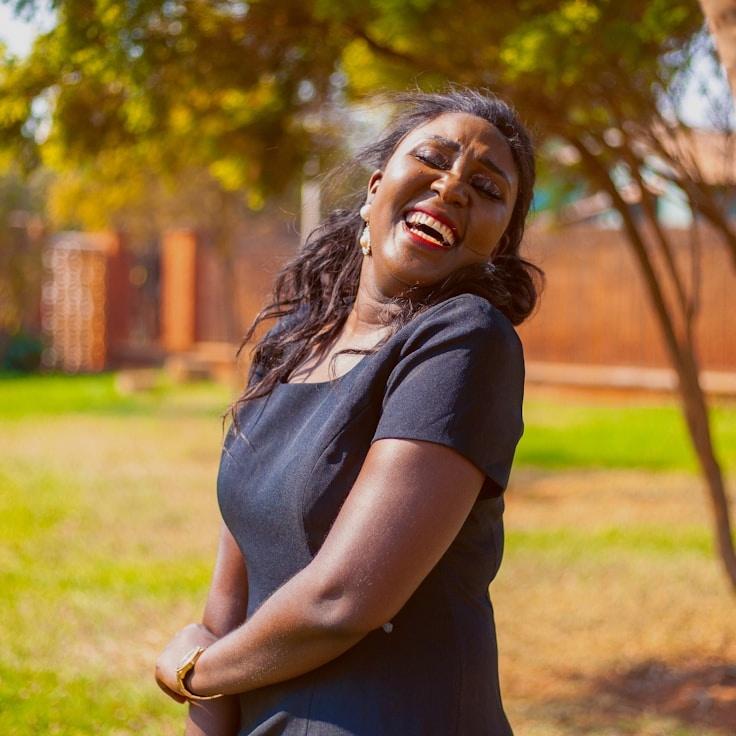 Kaveri Mehta, Lead Design Curator at PaperFieldNest, reviewing corporate floral arrangements